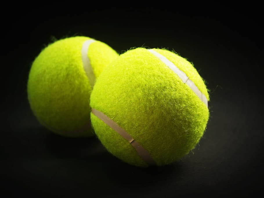 two, green, tennis balls, ball, racket, white, yellow, background, closeup, isolated