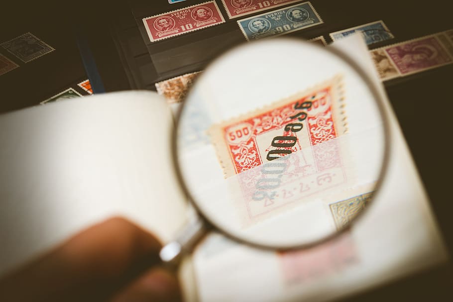 person, holding, magnifying, glass, philatelist, stamp collection, stamp, collecting, collection, loop