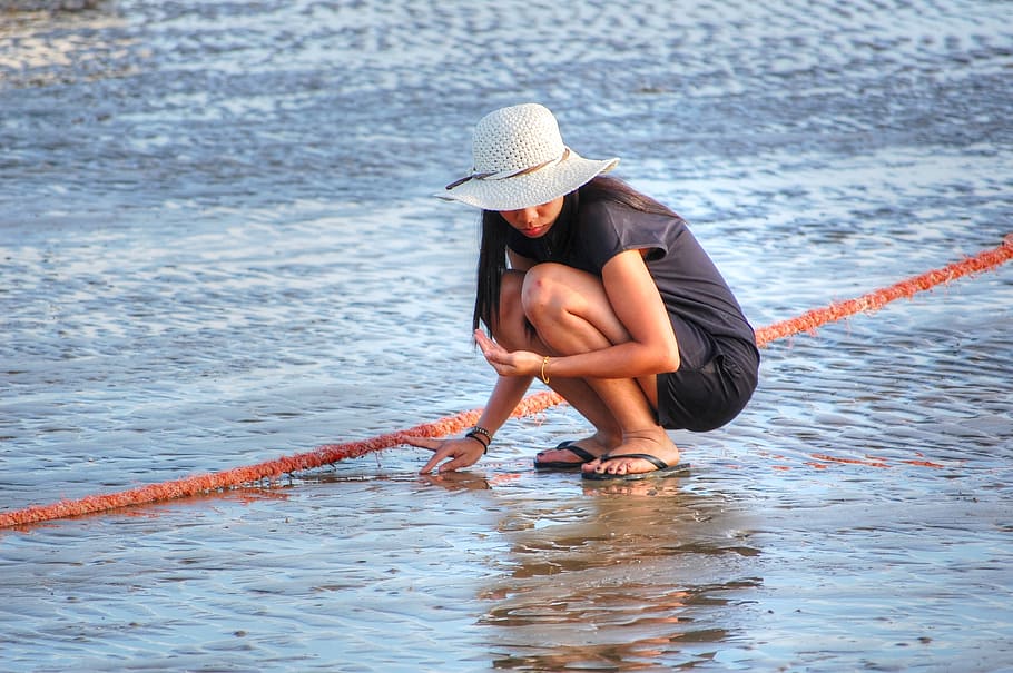 beach, shelling, woman, hat, water, clothing, one person, sea, nature, child