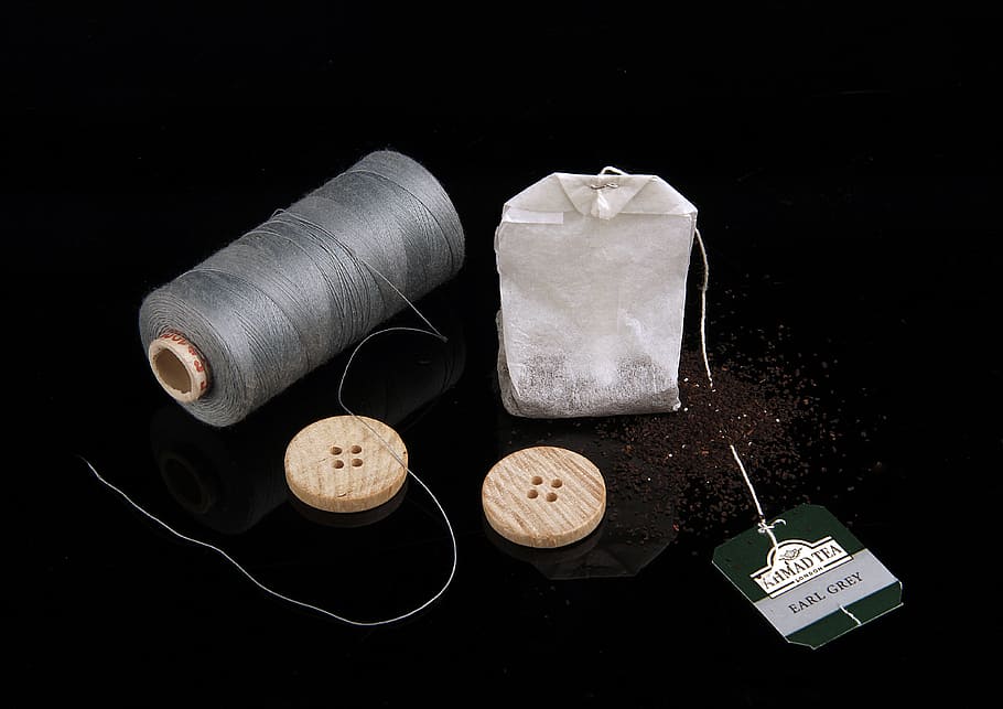 Thread, Button, Tea, Still Life, black background, studio shot, close-up, indoors, day, food and drink