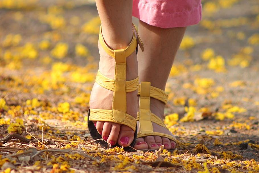 person, holding, pair, yellow, sandals, feet, lady, walking, sandles, female