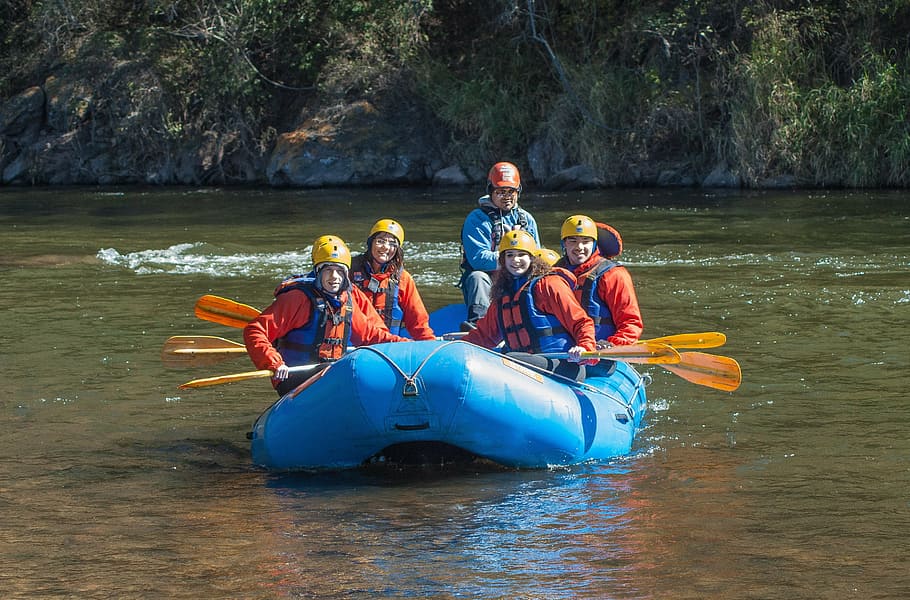 four, smiling, people, wearing, life vest, riding, inflatable boat, daytime, rafting, raft