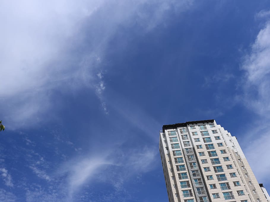 white, gray, concrete, high-rise, building, cloudy, blue, sky, sun, sunny