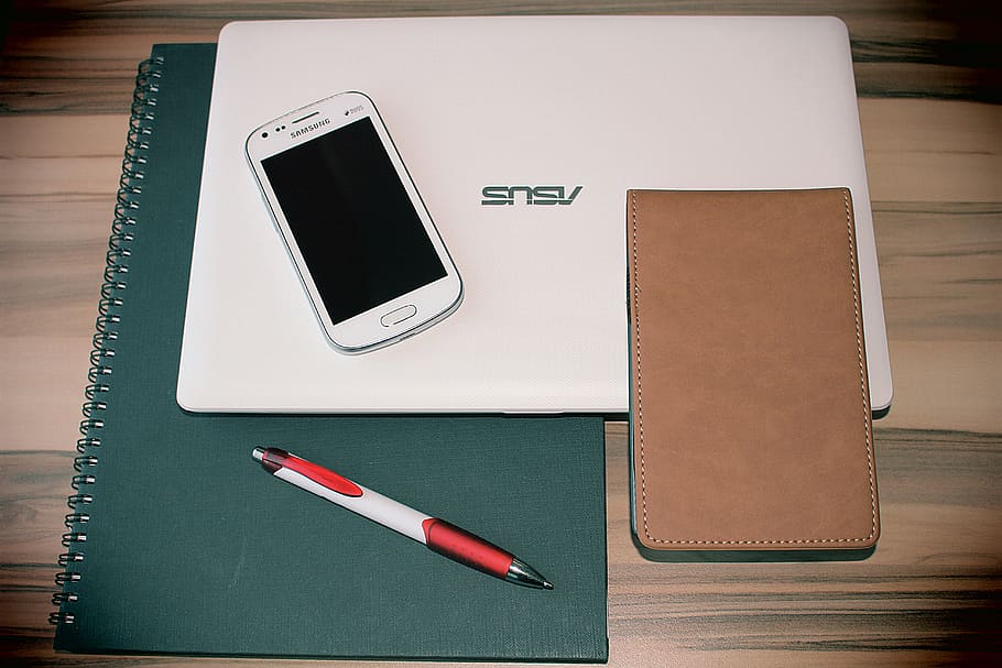 white, samsung android smartphone, asus laptop, smartphone, mobile phone, facilities, laptop, pen, notebook, office