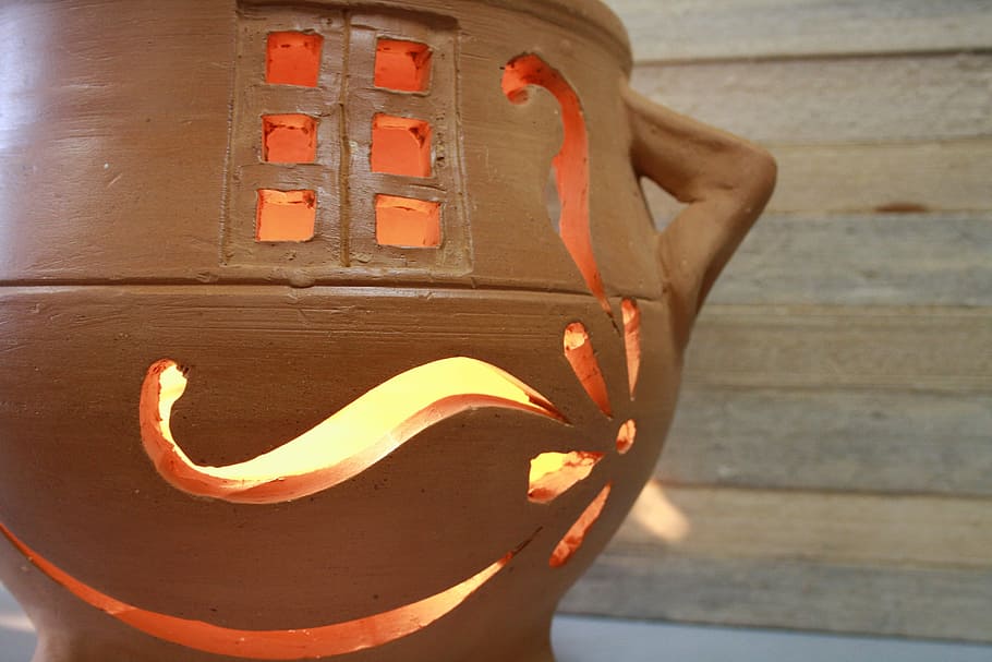 luminaire, vase, ceramics, crafts, close-up, human body part, wood - material, day, orange color, focus on foreground