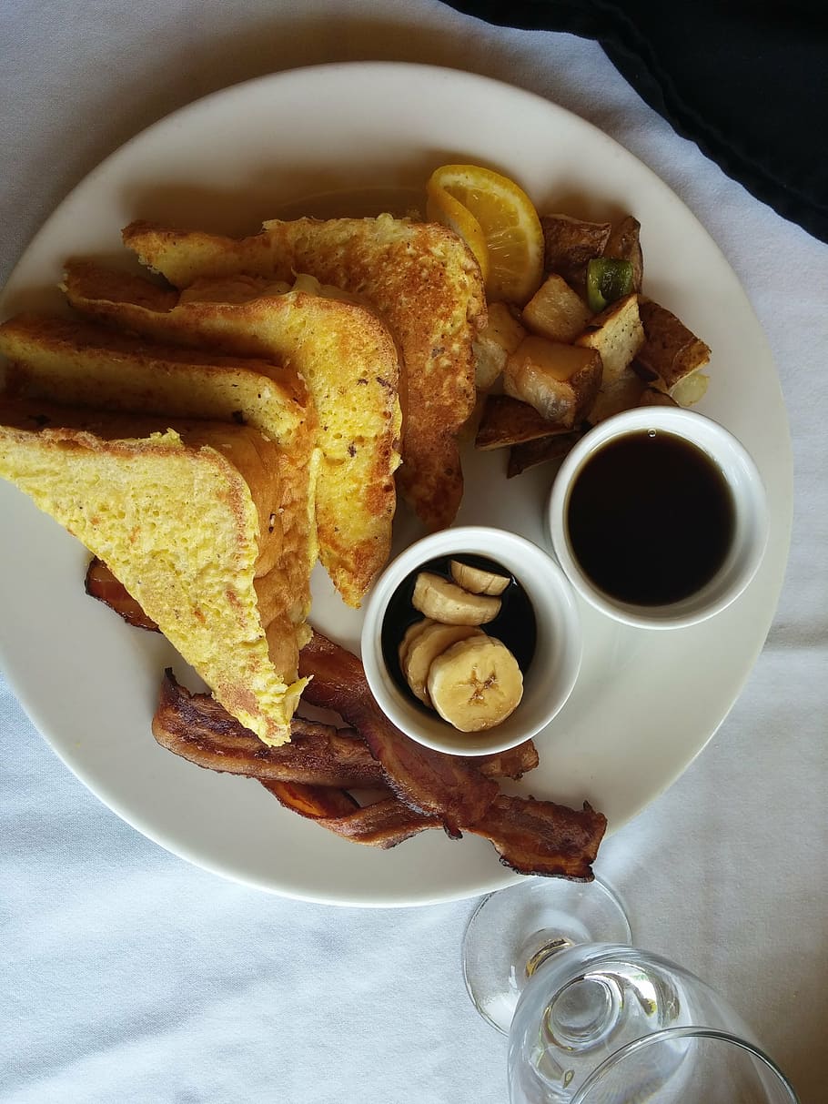 bread, pastry, plate photography, french toast, food, restaurant, bananas, bacon, water, glass