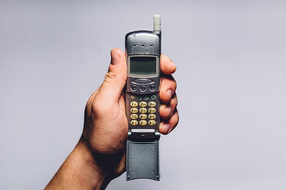 cell phone, oldschool, vintage, objects, hands, human hand, hand, holding, studio shot, human body part