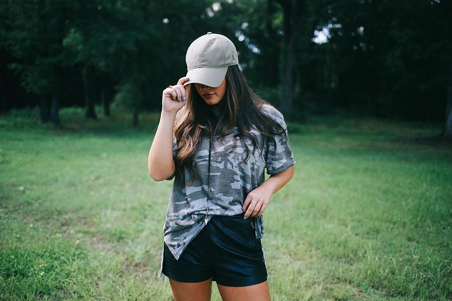 woman, wearing, gray, cap, woodland, camoflauge, shirt, standing, grass, field