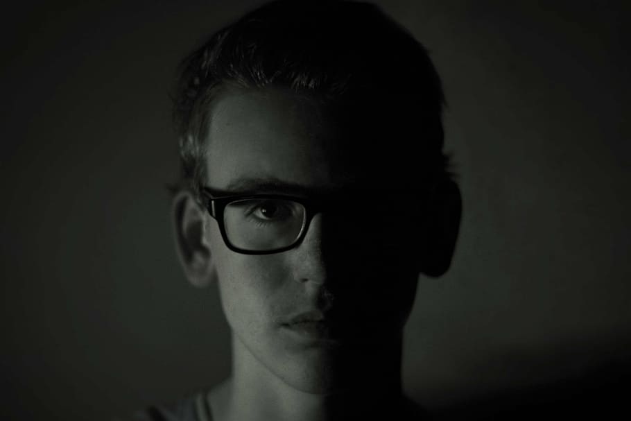 grayscale photo, man, wearing, eyeglasses, seriously, glasses, dark, face, black white, portrait