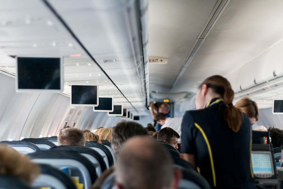 women, black, yellow, flight attendant uniform, aircraft, stewardess, mockup, sit, screens, holiday