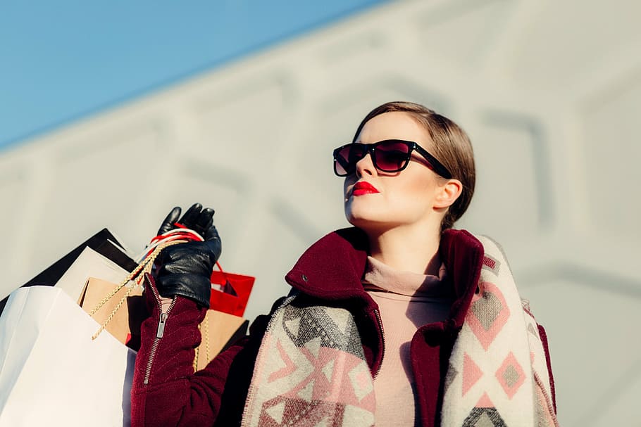 selective, focus photo, woman, holding, bags, red, long, coat, shop, bag