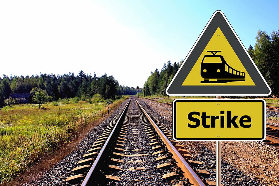 yellow-and-black train strike signage, daytime, rail, rail traffic, train, schedule, chaos, strike, railway traffic, trade union