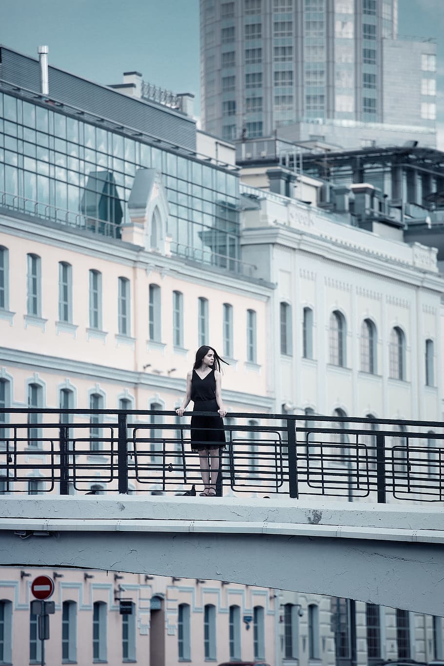 woman, black, v neck dress, gray, overpass, buildings, daytime, woman in black, v neck, dress