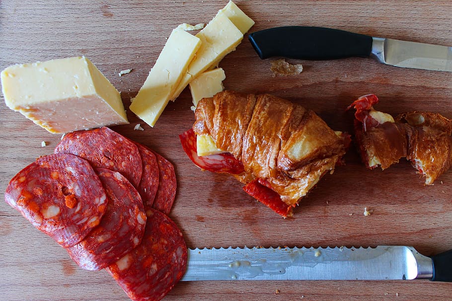 chorizo, croissant, snack, knife, cheese, food, board, food and drink, meat, freshness