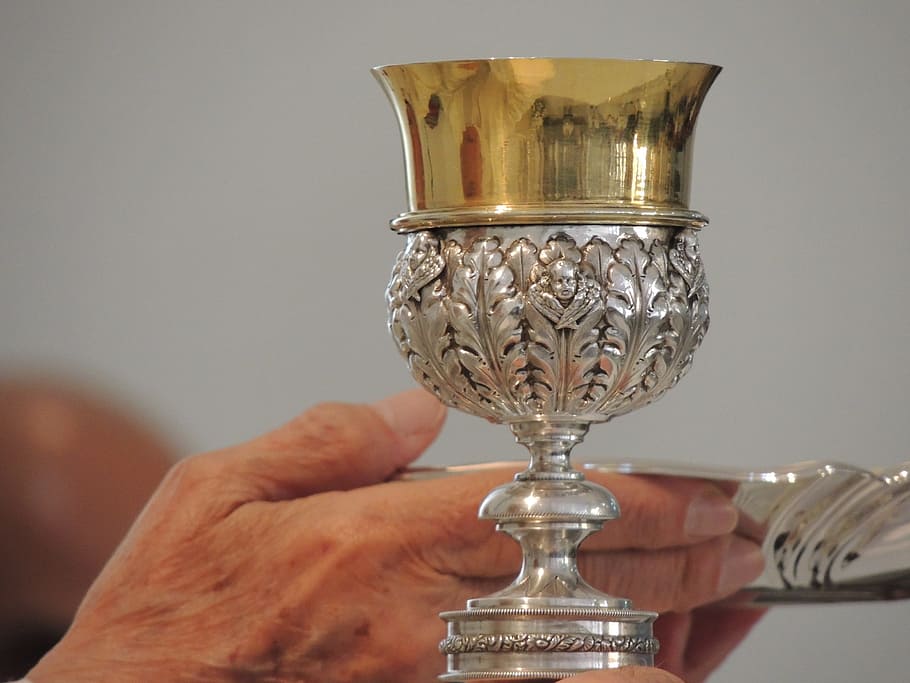 closeup, stainless, steel challis, person, hand, holding, plate, chalice, church, praying
