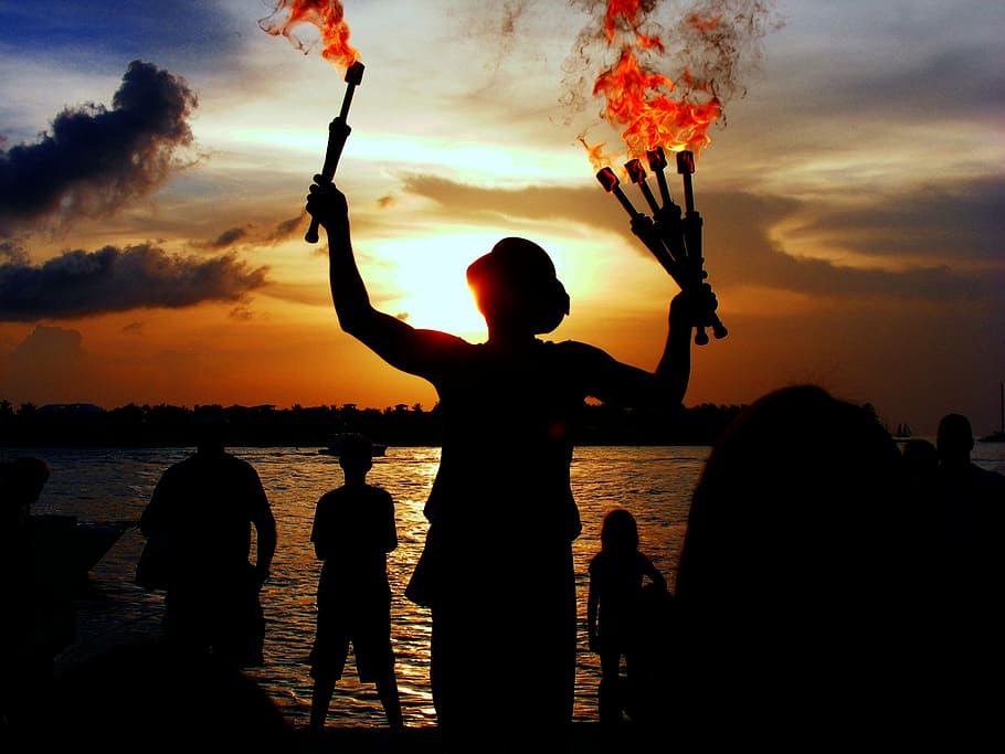 silhouette, person, holding, torch, flames, juggler, performer, water, sea, ocean