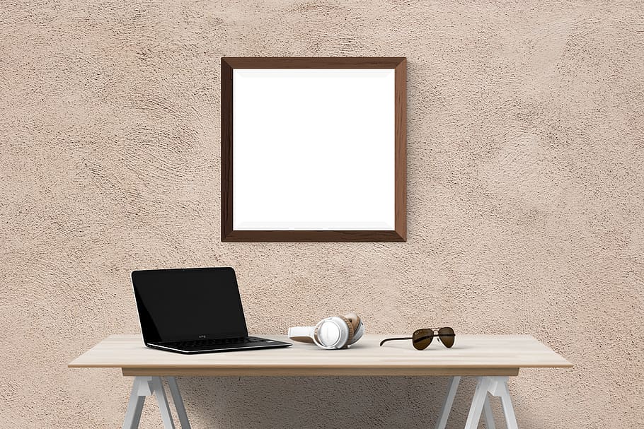 wall mirror, laptop, headphones, eyeglasses, table, poster, wall, mockup, interior, frame