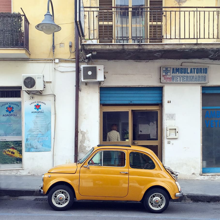 yellow, volkswagen beetle, parked, establishment, daytime, coupe, front, white, painted, concrete