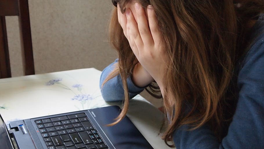 woman, wearing, blue, long-sleeved, top, bullying, hands, face, curl up, girl