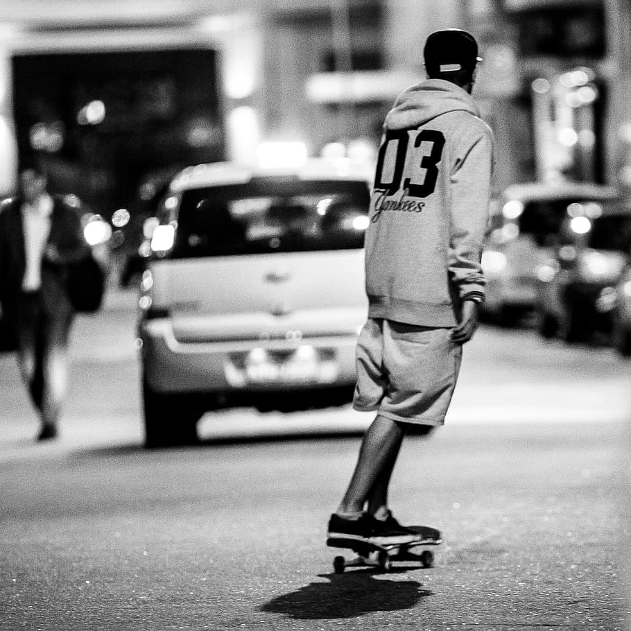 scale, man, pullover, riding, skateboard, city, street, full length, one person, real people