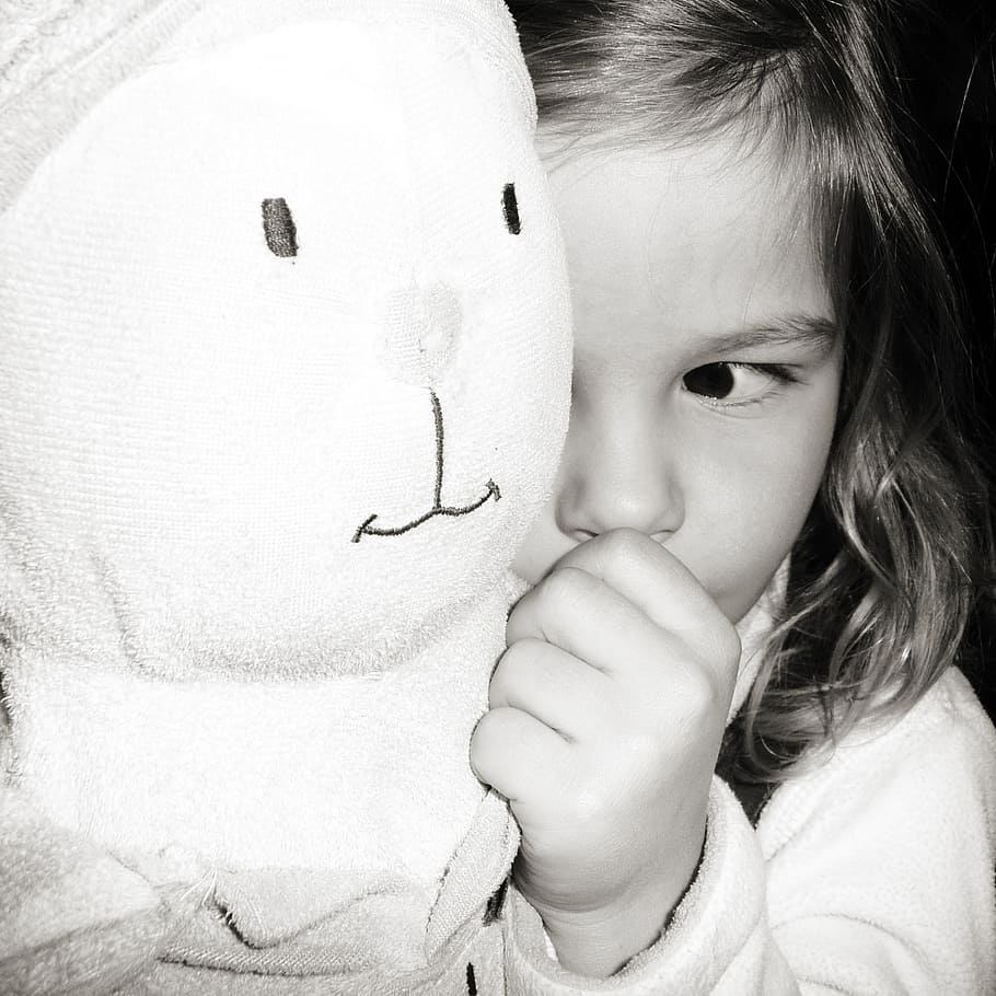 grayscale photography, child, holding, plush, toy, young, girl, tired, bunny, black and white
