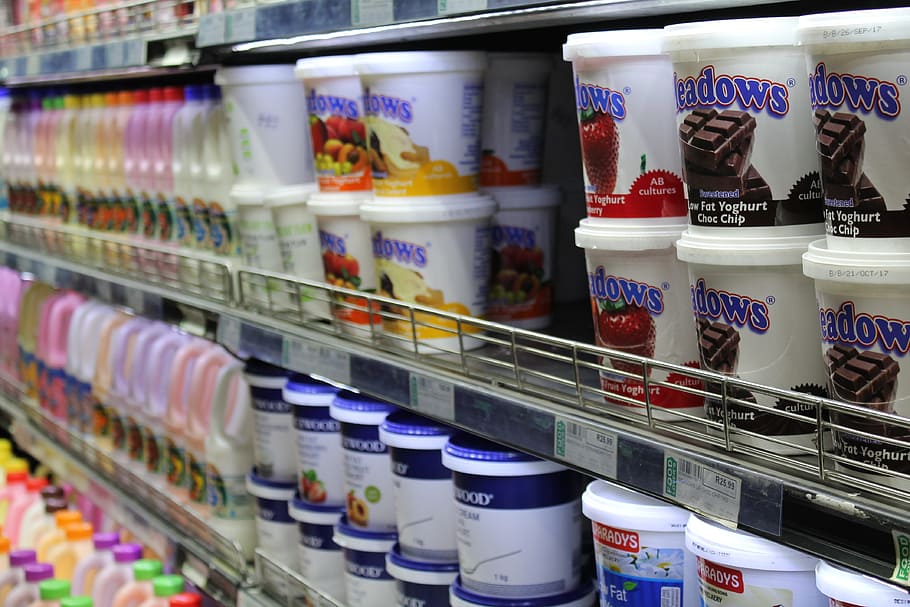 assorted-labeled cups, yogurt, dairy, refrigerator, grocery store, food, processed products, supermarket, choice, retail