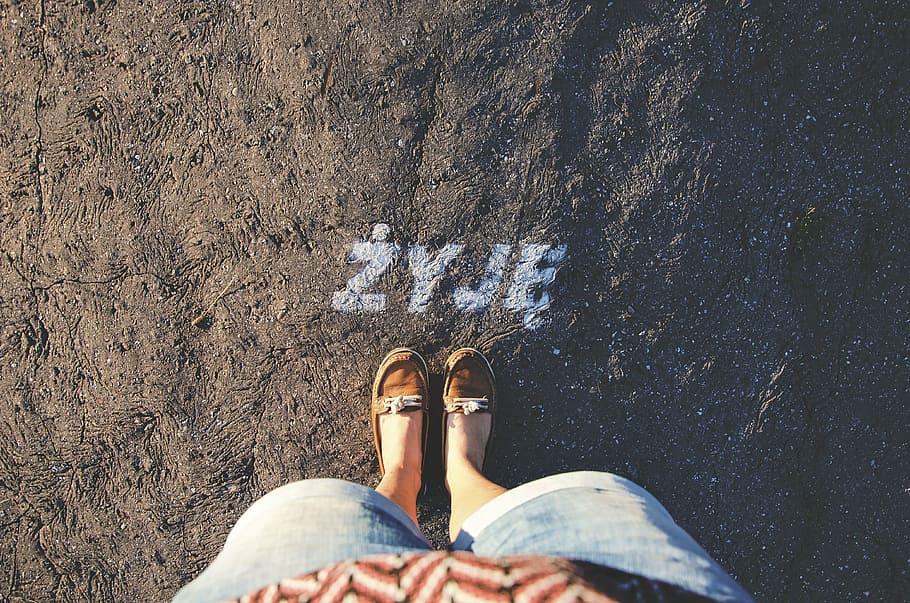 person, standing, zyje, written, concrete, floor, people, travel, adventure, shoes