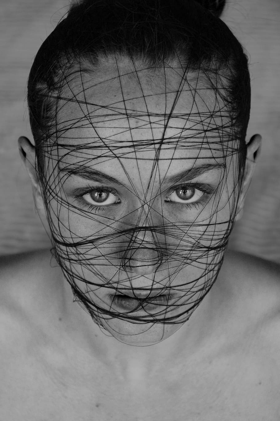 grayscale photo, woman, face, covered, black, thread, model, eye, art, black white