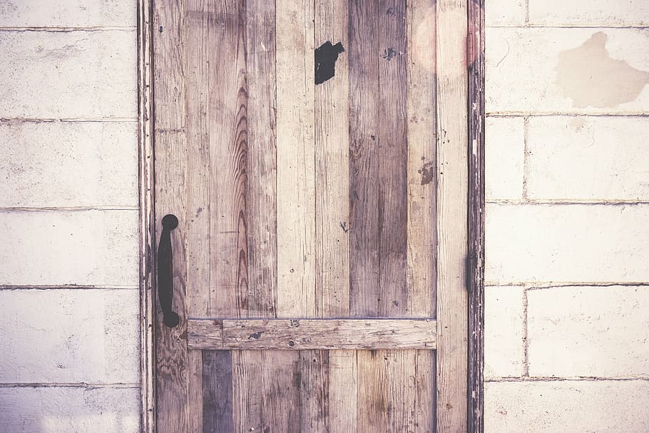 brown, wooden, door, gray, hallow block wall, pallet, wood, handle, wall, concrete