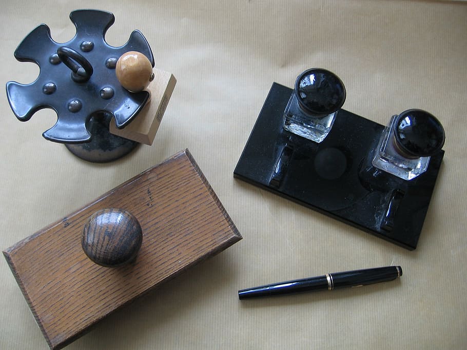 stamps, pen, stamp, wooden stamp, high angle view, indoors, close-up, day, table, still life