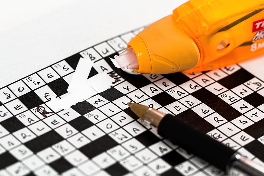 black, white, crossword puzzle, pen, correction tape, mistake, error, correction, wrong, oops