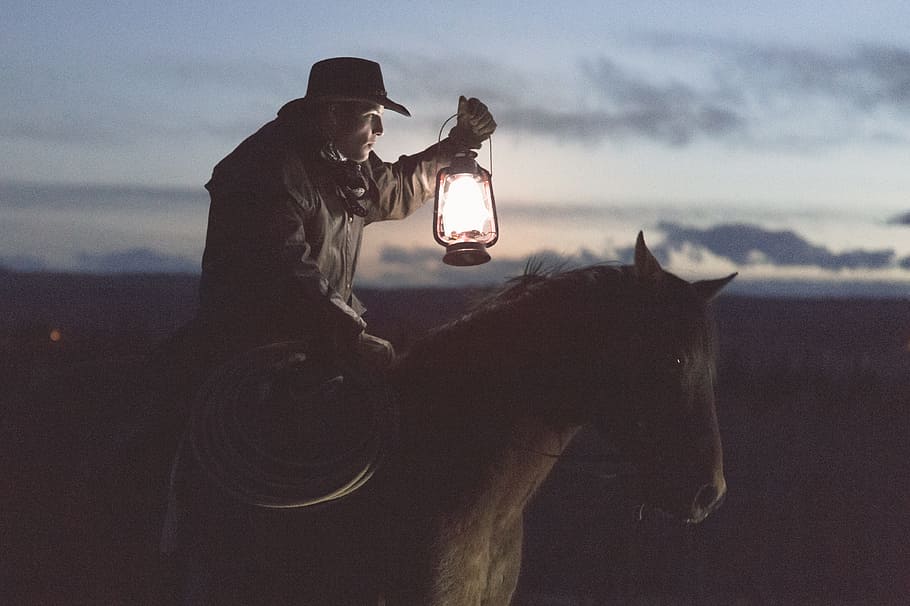 cowboy, holding, lantern, riding, horse, guy, man, male, people, side