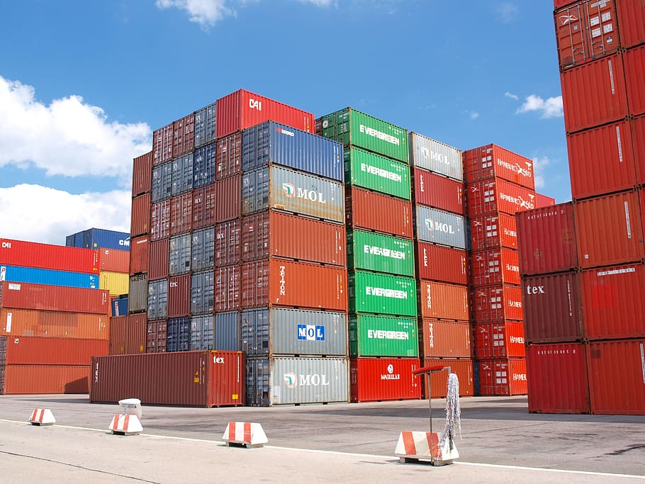stacked, assorted-color cargo container lot, container, cargo, freight harbor, cargo container, container ship, goods, terminal, storage