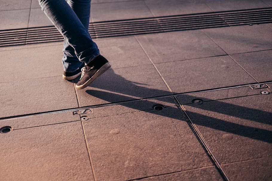 shoes, jeans, pants, pedestrian, walking, ground, shadow, path, low section, human leg
