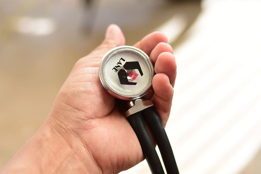 hand, stethoscope, human hand, human body part, holding, one person, focus on foreground, close-up, body part, adult