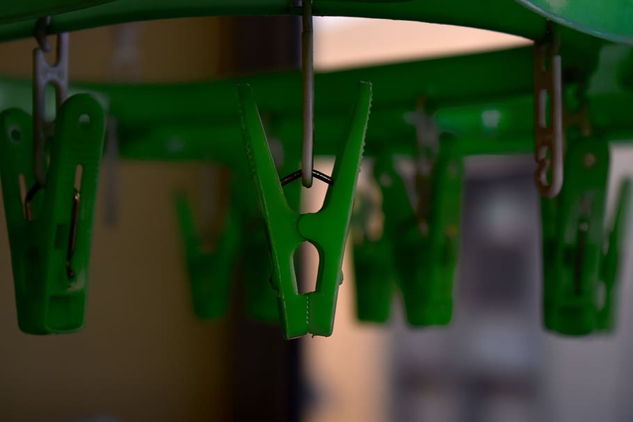 clothespins, tweezers, green clips, green color, focus on foreground, hanging, close-up, day, indoors, glass - material