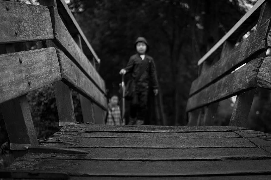grayscale photo, man, walking, bridge, boy, wooden, grayscale, black and white, steps, steps and staircases