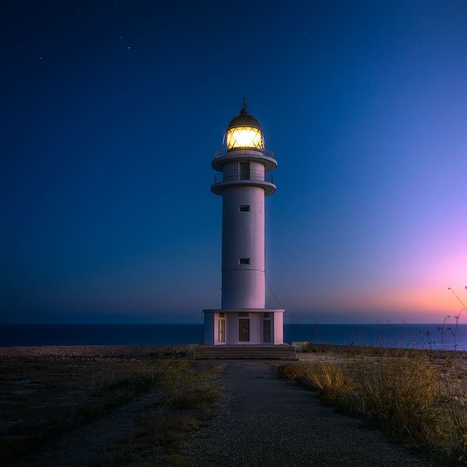 lighted, lighthouse, nighttime, beach, cliff, coast, light, ocean, sea, seashore