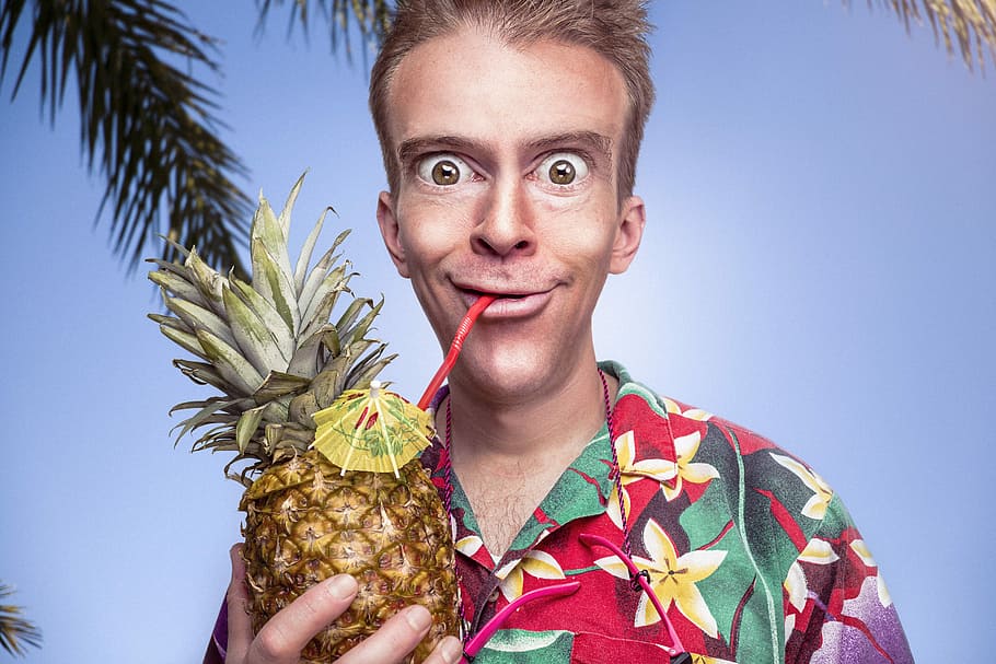 man, red, yellow, green, flora button-up shirt, holding, pineapple, blue, sky, button-up