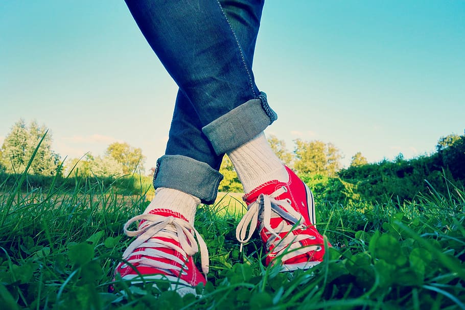 person, wearing, red, sneakers, grass field, leg, foot, body, female, standing