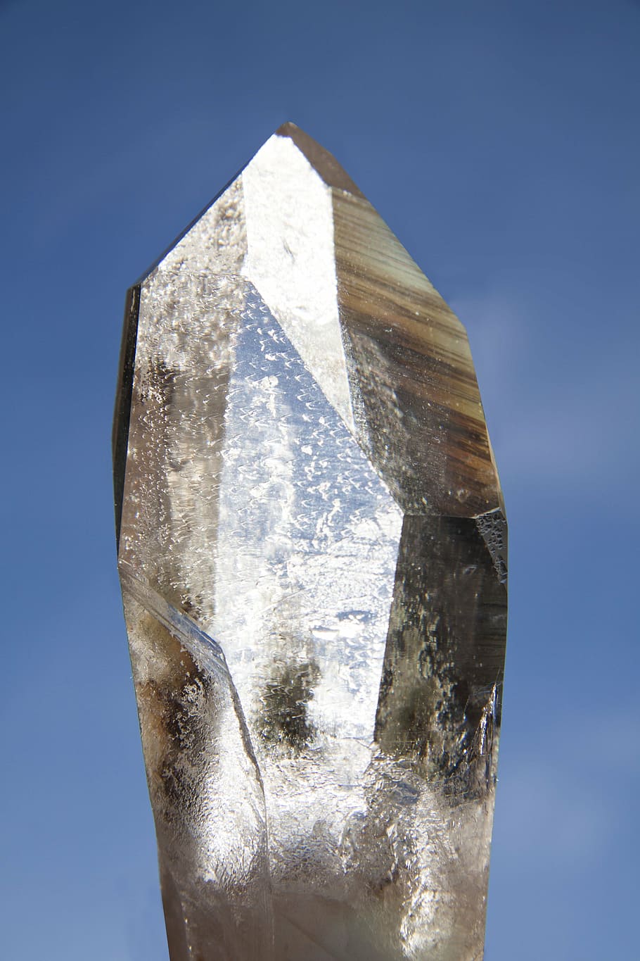 gray mineral stone, pure quartz, rock crystal, mineral, trigonal, prism surfaces, silicon dioxide, transparent, clear, back light
