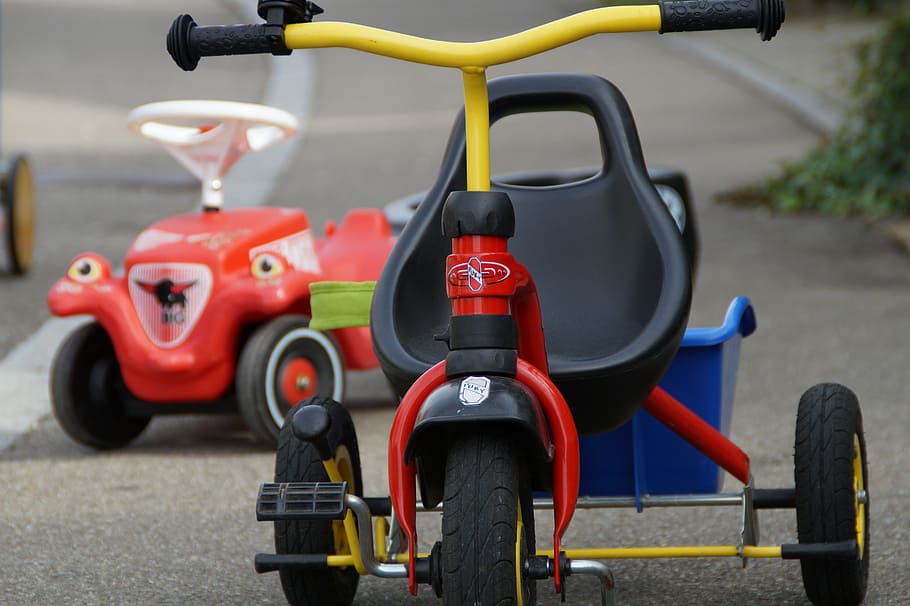 yellow, red, trike, road infront, ride-on toy, children's vehicles, vehicles, bobby car, tricycle, play
