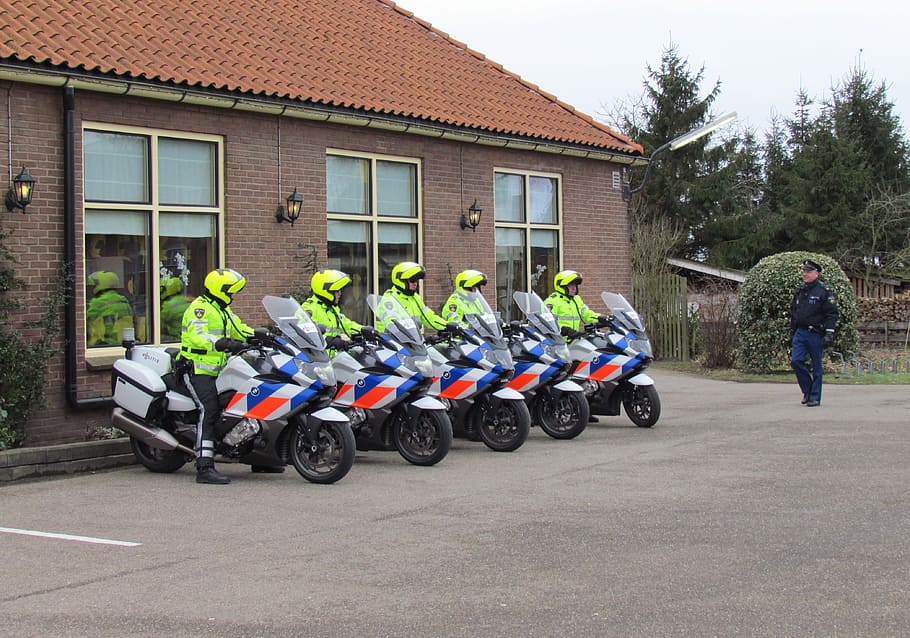 five, police officers, riding, motorcycle, front, brown, painted, building, netherlands, police