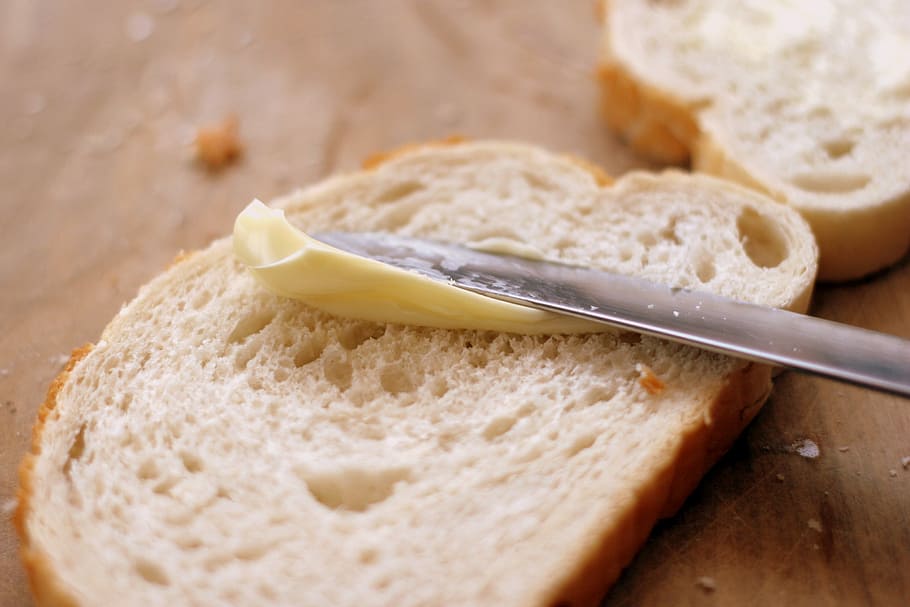 person, putting, butter, slide, bread, knife, crumbs, breakfast, spread, food