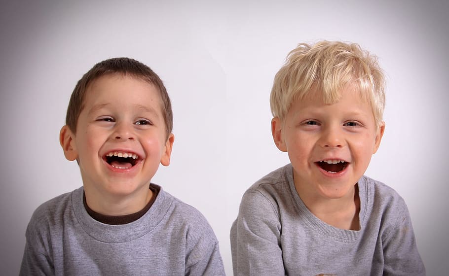 two, toddlers, wearing, heather, gray, tops, smiling, white, wall, boy