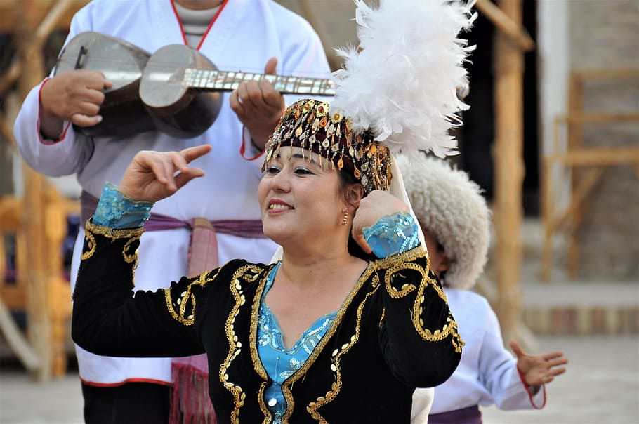 uzbekistan, folklore, costume, central asia, khiva, performance, arts culture and entertainment, focus on foreground, traditional clothing, performing arts event