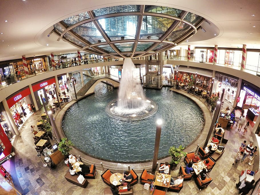round water fountain, inside, restaurant, round, water fountain, indoors, people, architecture, large group of people, high angle view