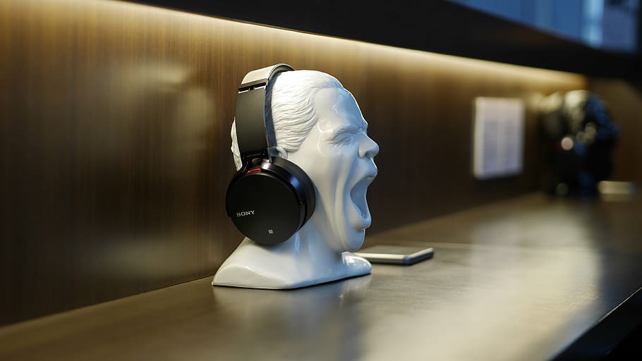 black, wireless, headphones, white, person, head figurine, head, sculpture, face, figure