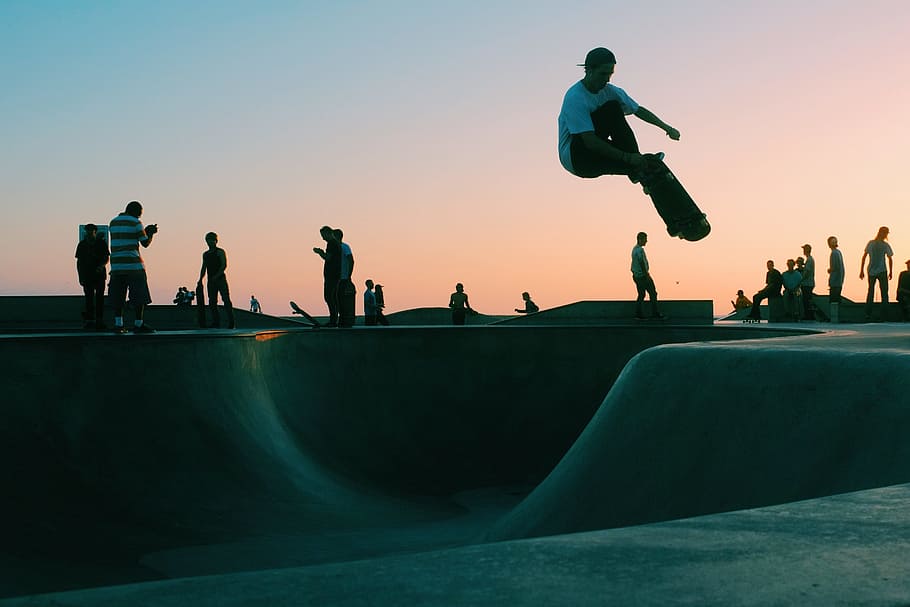man playing skates, skateboarding, venue, sport, game, people, men, park, sky, clouds