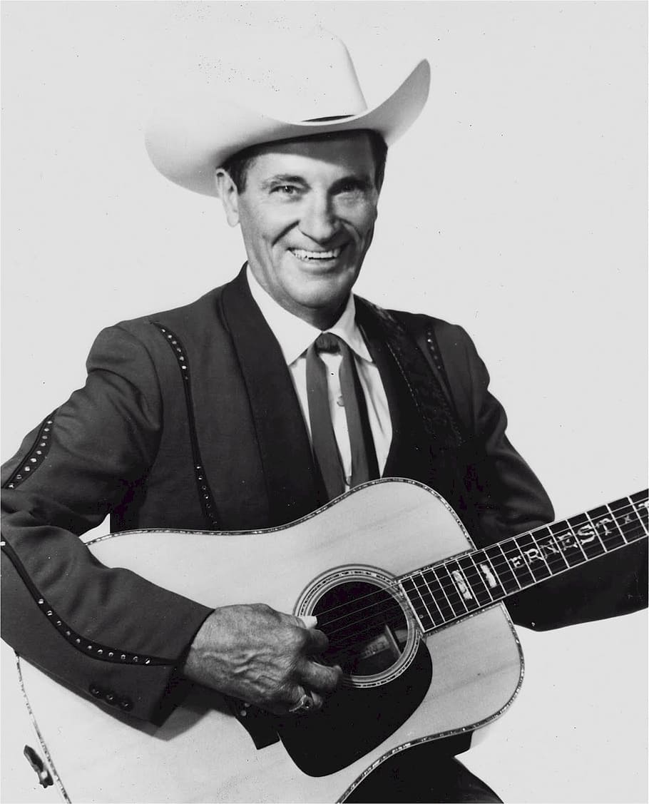 ernest tubb, música country, cantante, compositor, trovador de texas, pionero, salón de la fama de la música country, premio grammy, grand ole oprey, sonriente